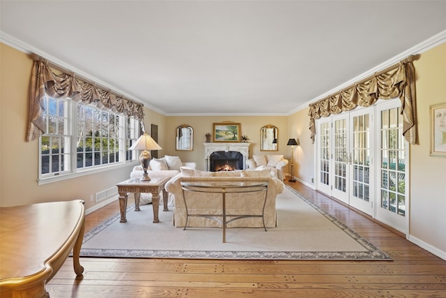 living room featuring crown molding and hardwood / wood-style flooring