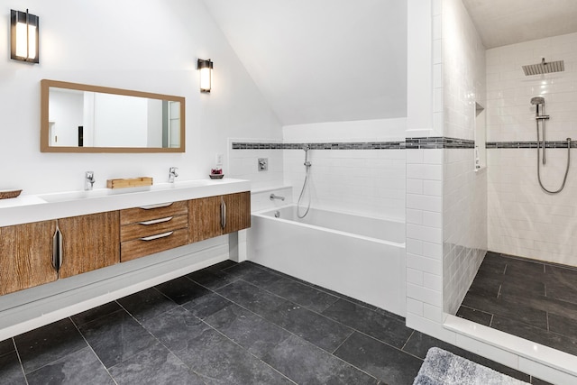 bathroom featuring shower with separate bathtub, lofted ceiling, and vanity