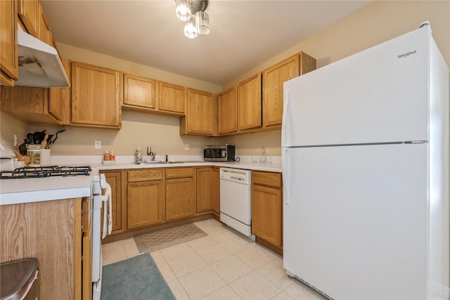 kitchen with white appliances and sink