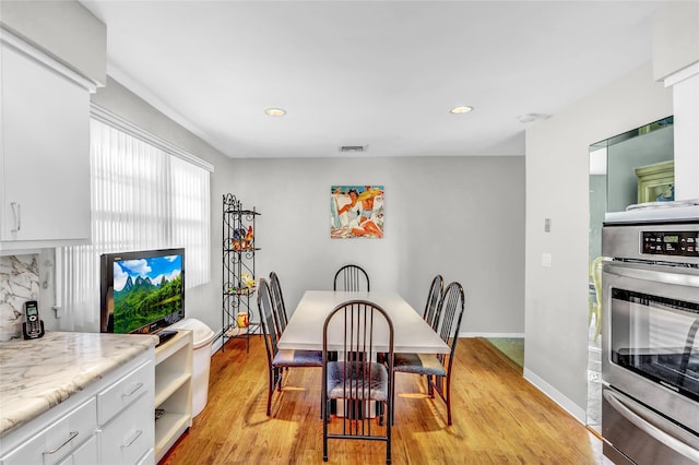 dining room with light hardwood / wood-style flooring