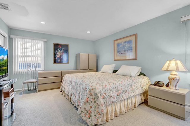 bedroom featuring light colored carpet