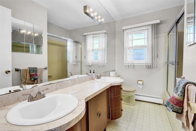 bathroom featuring vanity, a baseboard radiator, a shower with shower door, and toilet