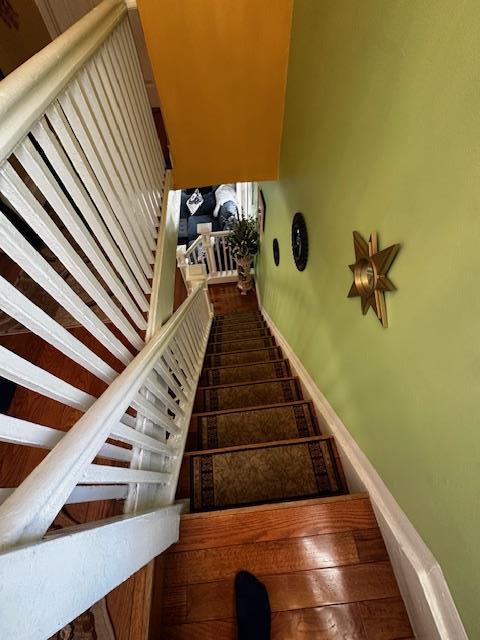 stairs with wood-type flooring