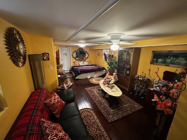 bedroom featuring hardwood / wood-style flooring and ceiling fan