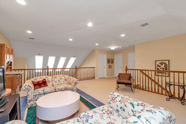 living room featuring lofted ceiling and light carpet