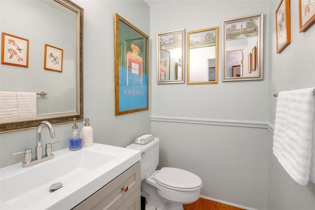 bathroom with vanity and toilet