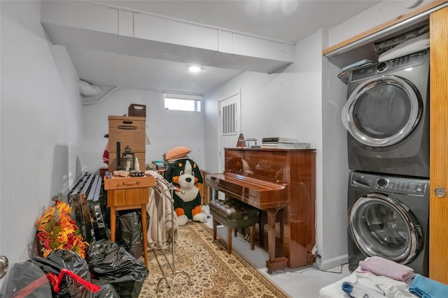 washroom with stacked washer / drying machine