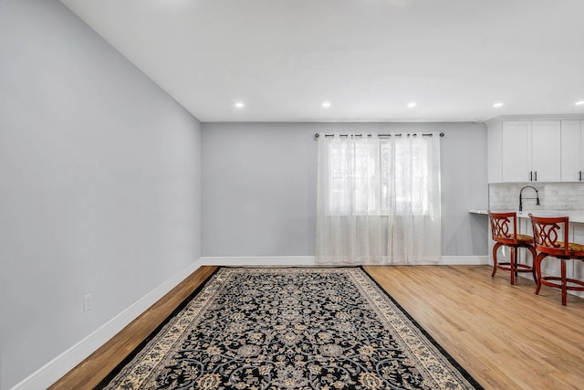 interior space featuring sink and light wood-type flooring