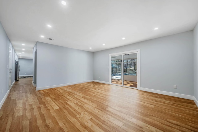 unfurnished room with light hardwood / wood-style flooring