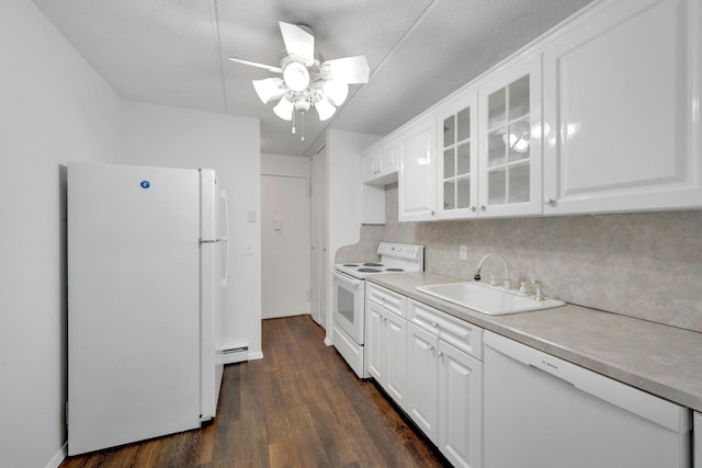 kitchen with sink, white appliances, a baseboard heating unit, white cabinets, and dark hardwood / wood-style flooring