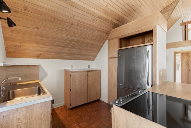 kitchen featuring sink, dark parquet flooring, stainless steel fridge, and wooden ceiling