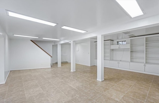 basement featuring a baseboard heating unit