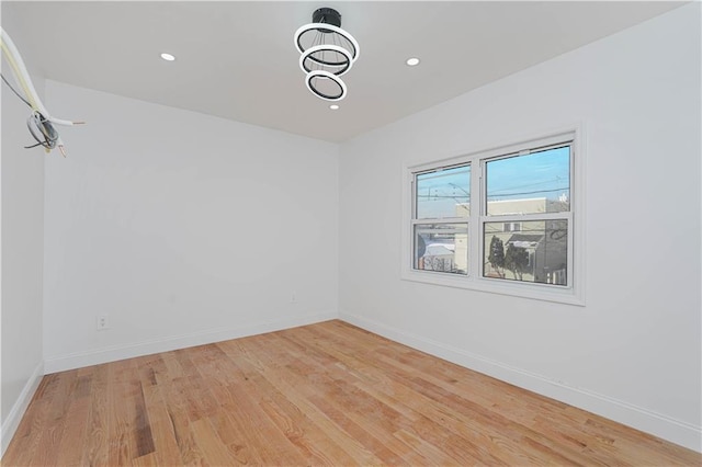 spare room featuring light wood-type flooring