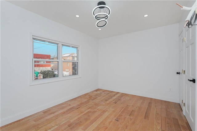 spare room featuring light wood-type flooring