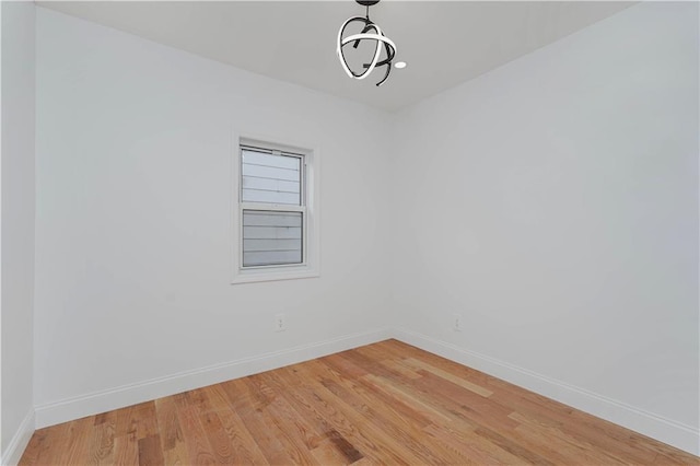 unfurnished room featuring hardwood / wood-style floors