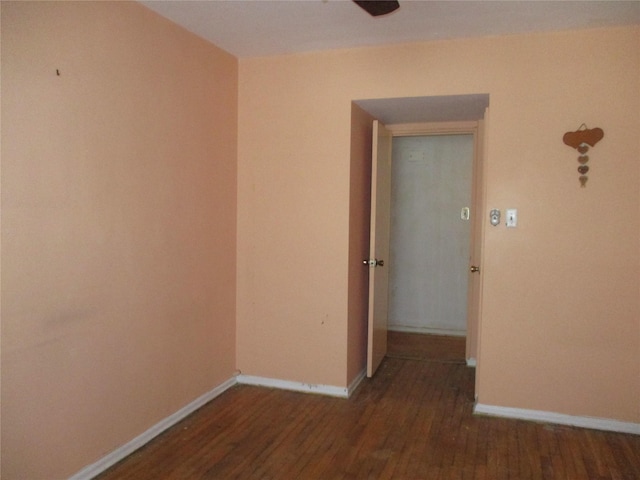 unfurnished room featuring dark hardwood / wood-style flooring