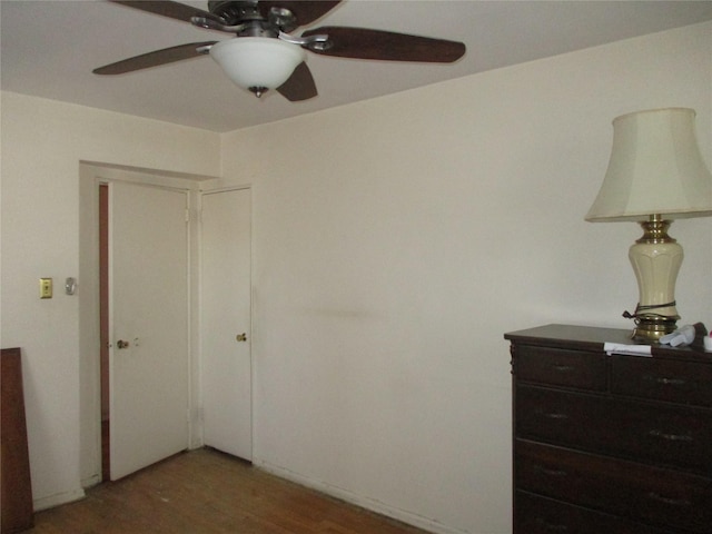 bedroom featuring dark wood-type flooring and ceiling fan