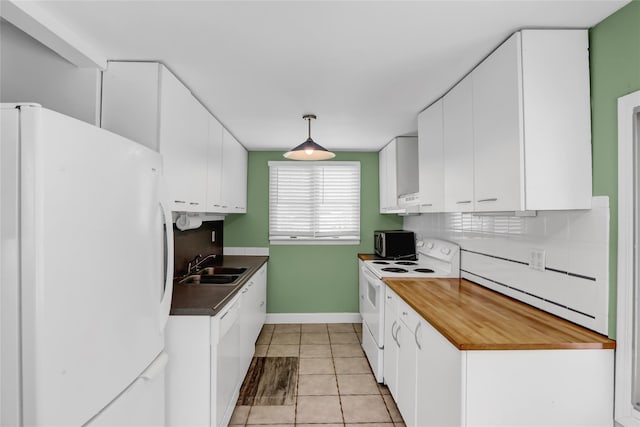 kitchen featuring white cabinets, white appliances, and decorative light fixtures