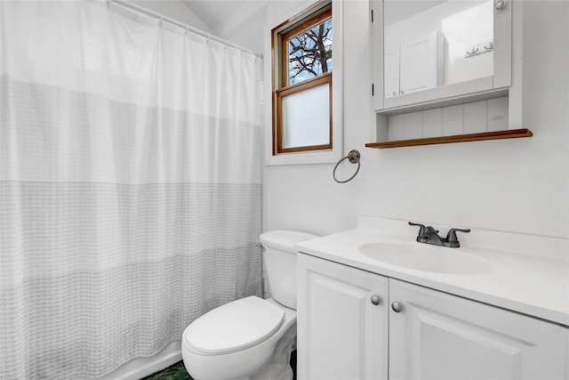 bathroom with lofted ceiling, vanity, toilet, and a shower with shower curtain