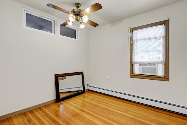 empty room with cooling unit, ceiling fan, light hardwood / wood-style floors, and a baseboard heating unit