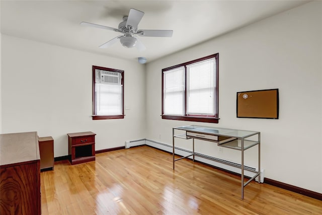 interior space featuring a baseboard radiator, ceiling fan, and light wood-type flooring