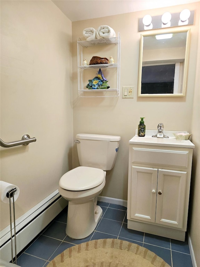 bathroom with a baseboard radiator, vanity, toilet, and tile patterned flooring