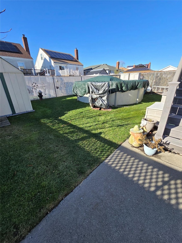 view of yard featuring a covered pool