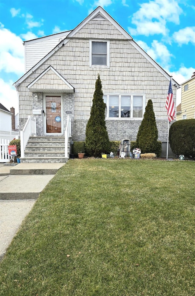 bungalow-style house featuring a front yard