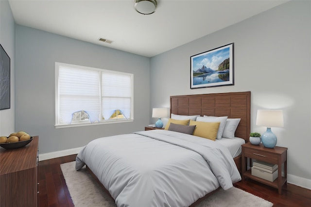 bedroom featuring dark hardwood / wood-style floors