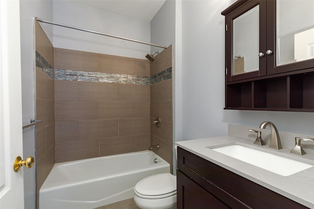 full bathroom featuring tiled shower / bath combo, vanity, and toilet