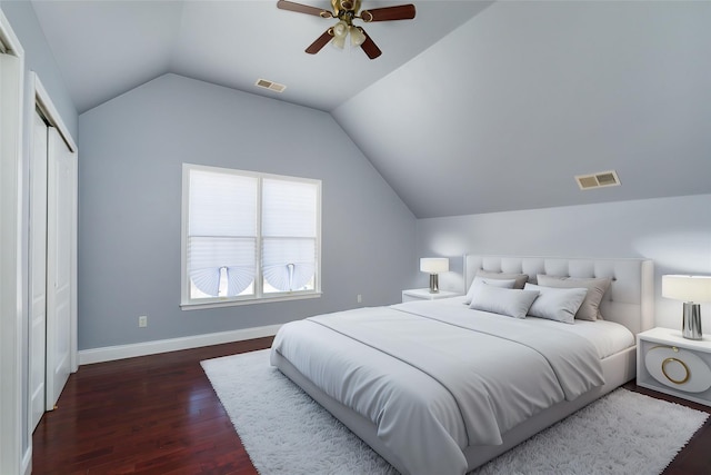 bedroom with ceiling fan, lofted ceiling, and dark hardwood / wood-style flooring