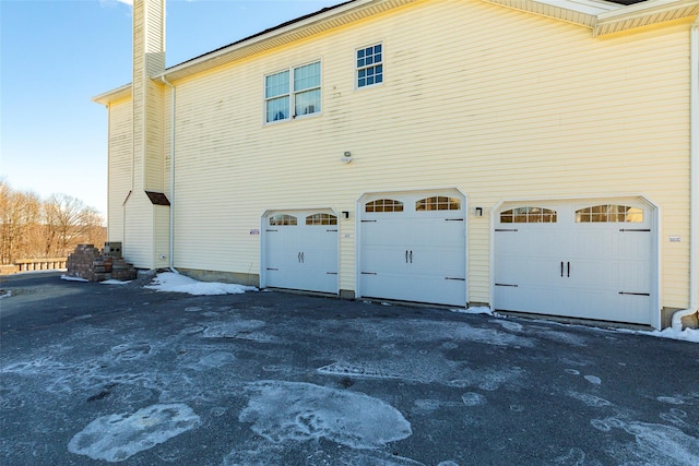 view of home's exterior featuring a garage