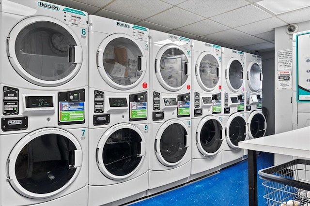 shared laundry area with stacked washer and dryer and washer and dryer