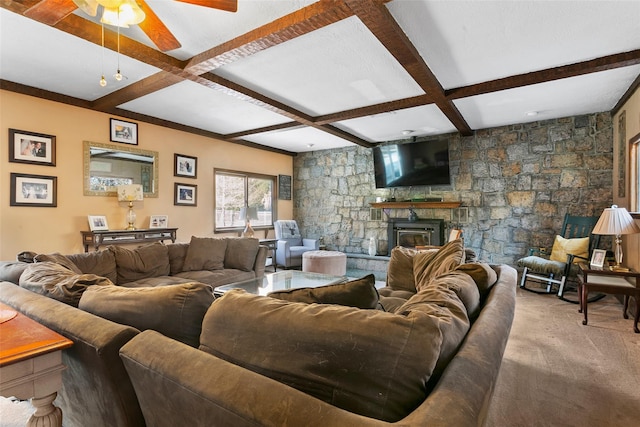 living room featuring a fireplace, coffered ceiling, carpet flooring, a ceiling fan, and beam ceiling