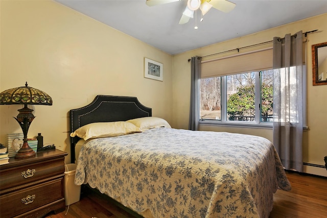 bedroom featuring a ceiling fan and dark wood-style flooring