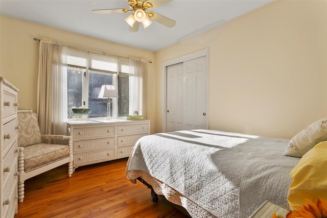 bedroom featuring a closet, ceiling fan, and wood finished floors