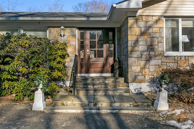 view of exterior entry with stone siding