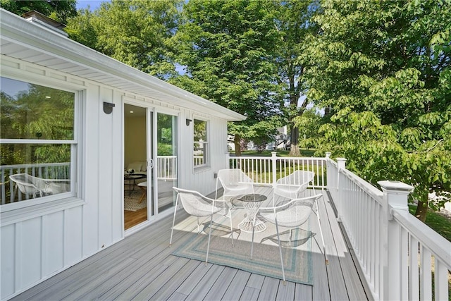 deck featuring outdoor dining area