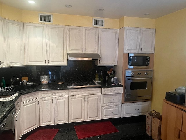 kitchen featuring tasteful backsplash, white cabinets, sink, and black appliances