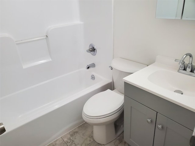 full bathroom featuring vanity, toilet, and washtub / shower combination