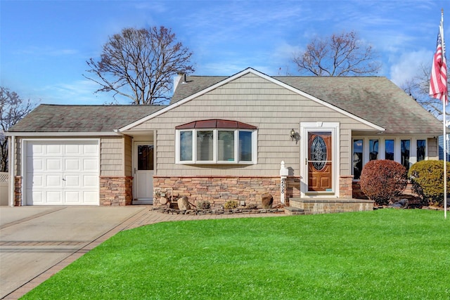 view of front of property with a garage and a front yard