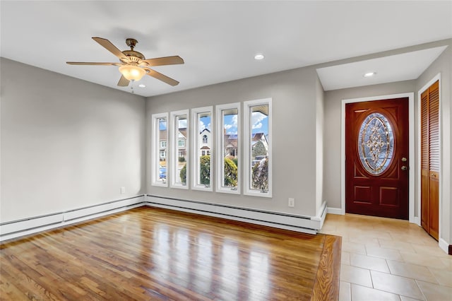 entryway featuring baseboard heating and ceiling fan