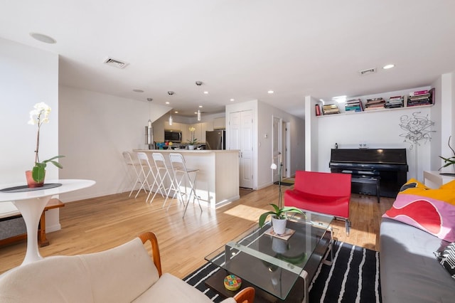 living room with light hardwood / wood-style floors