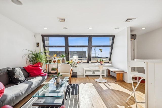 living room with light hardwood / wood-style floors