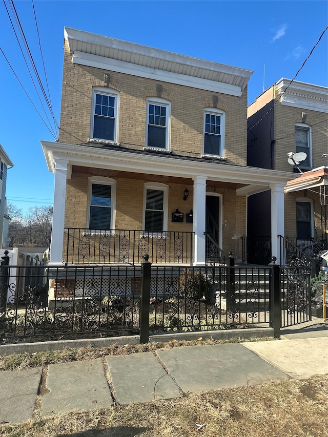 view of front of property featuring covered porch