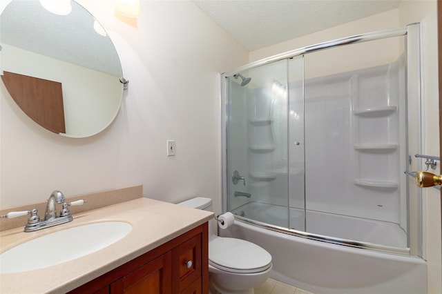 full bathroom featuring vanity, toilet, enclosed tub / shower combo, and a textured ceiling