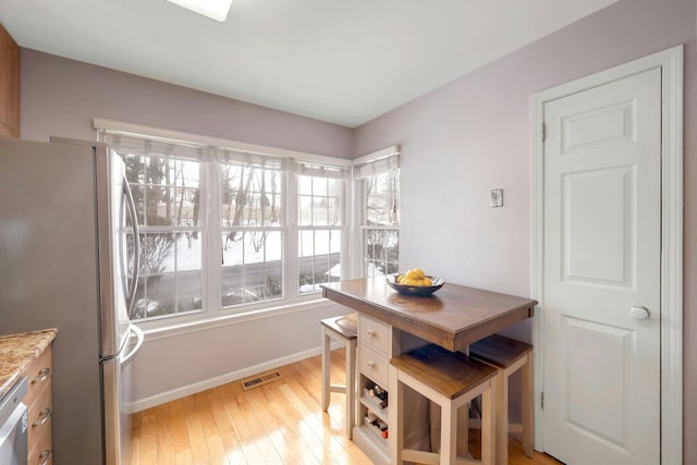 dining space featuring light hardwood / wood-style flooring