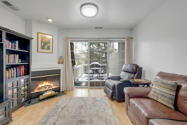 sitting room with light hardwood / wood-style floors