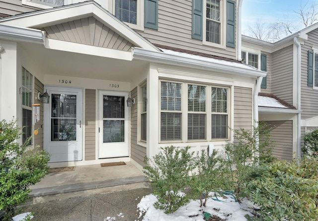 view of snow covered property entrance