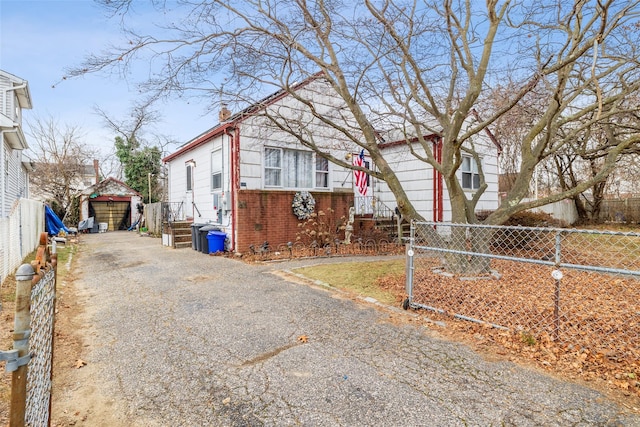 view of front of home with an outbuilding and a garage